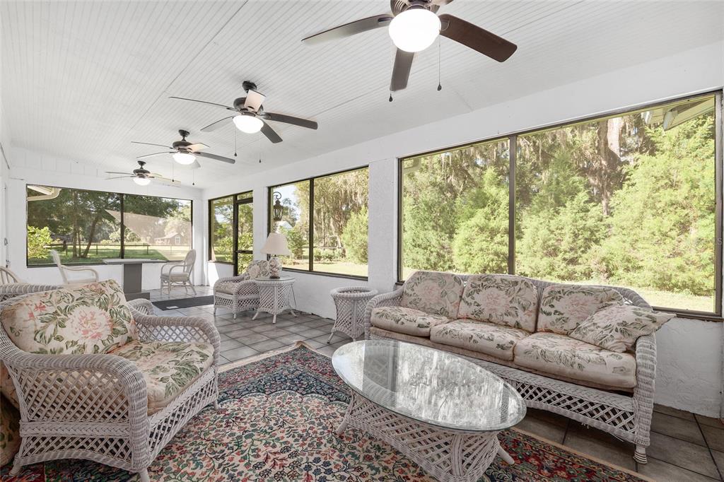 17067 Northwest Gainesville Road Reddick, FL 32686 - Photo 17 of 25 a living room with furniture and a large window