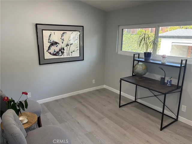 a workspace with furniture and a window