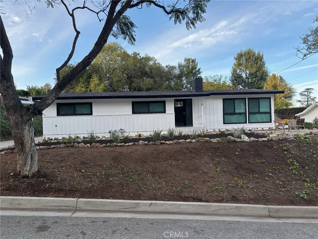 front view of a house with a dry yard