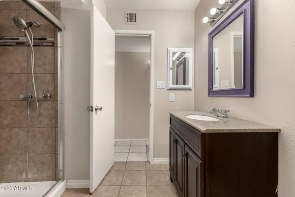 a bathroom with a sink a vanity and a mirror