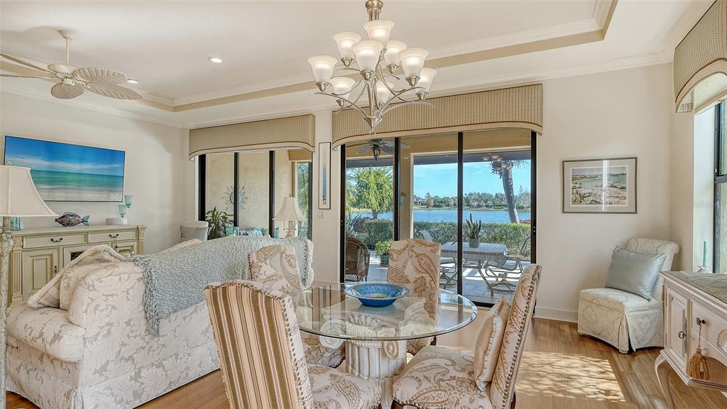 12759 Del Corso Loop Bradenton, FL 34211 - Photo 17 of 74 a living room with furniture large window and wooden floor