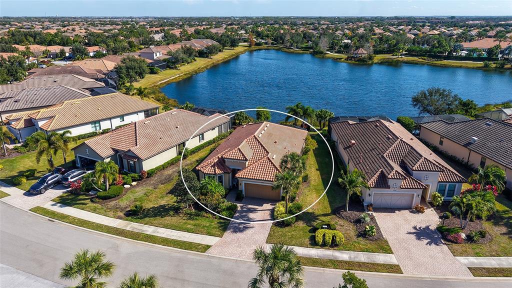 12759 Del Corso Loop Bradenton, FL 34211 - Photo 2 of 74 an aerial view of house with yard swimming pool and ocean view
