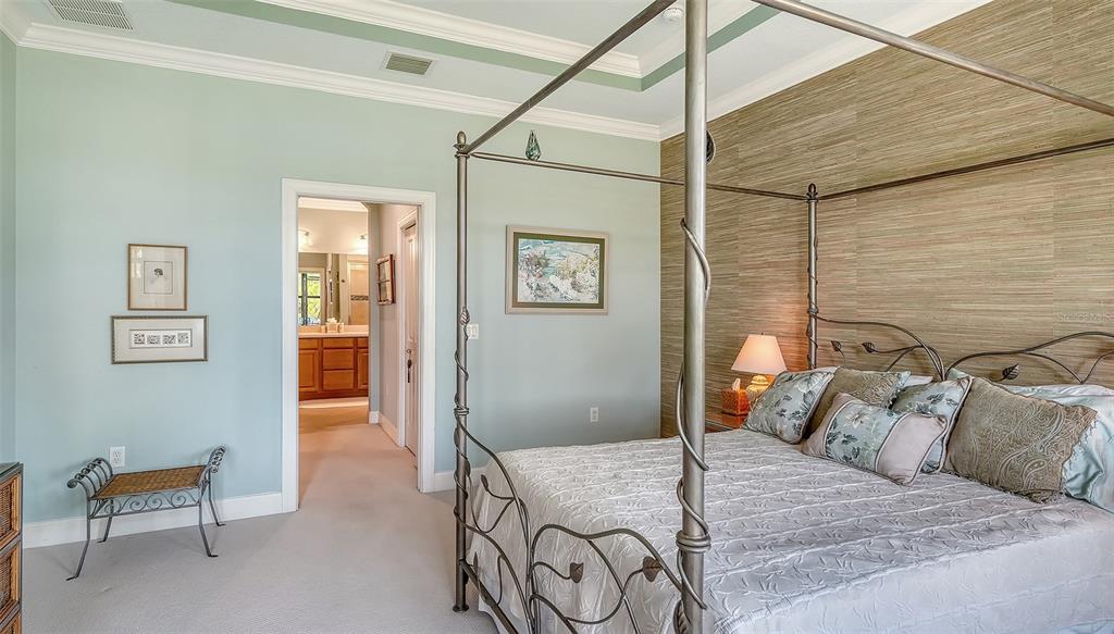 12759 Del Corso Loop Bradenton, FL 34211 - Photo 26 of 74 a bedroom with a bed and a chair