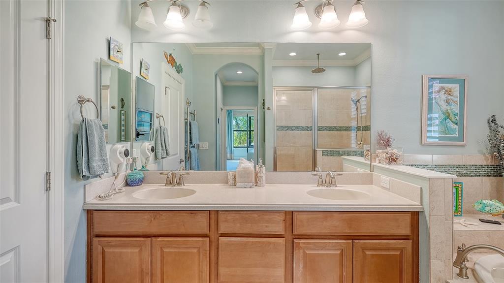 12759 Del Corso Loop Bradenton, FL 34211 - Photo 29 of 74 a bathroom with a sink and a mirror