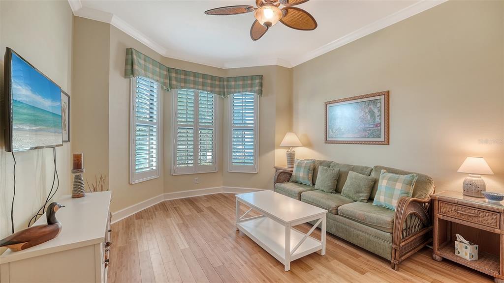 12759 Del Corso Loop Bradenton, FL 34211 - Photo 32 of 74 a living room with furniture and a flat screen tv