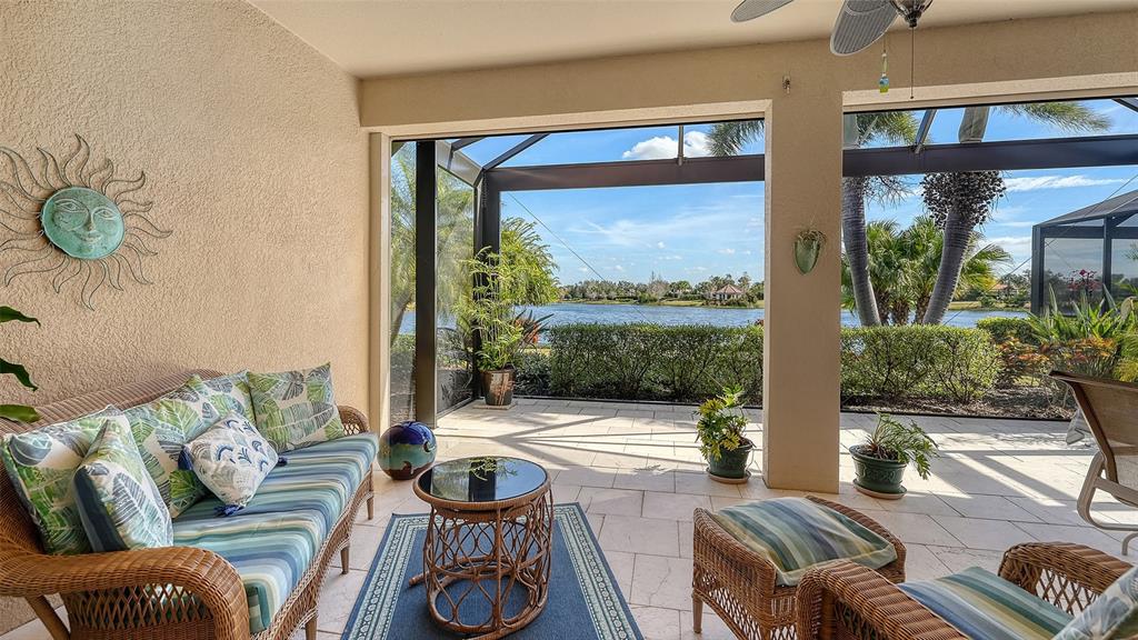 12759 Del Corso Loop Bradenton, FL 34211 - Photo 38 of 74 a living room with furniture and a large window
