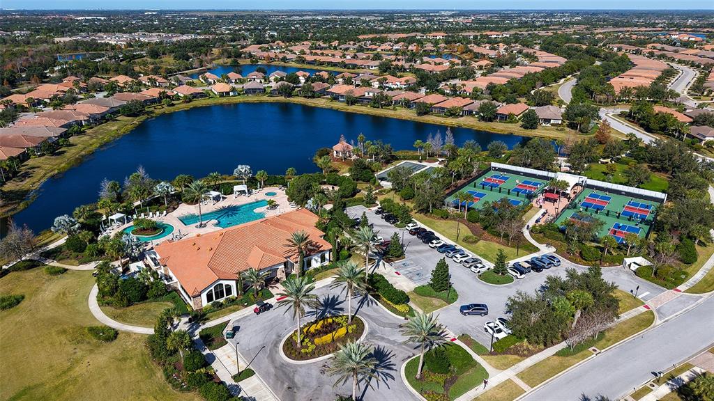 12759 Del Corso Loop Bradenton, FL 34211 - Photo 71 of 74 an aerial view of a house with a swimming pool yard and outdoor seating