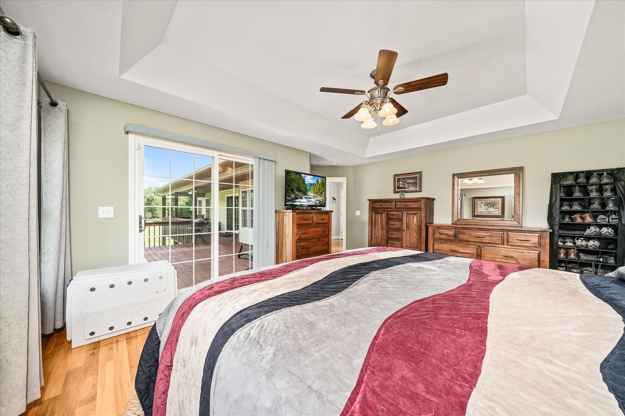 125 Clarence Lee Road Lancing, TN 37770 - Photo 11 of 55 a spacious bedroom with a bed and glass walk in closet