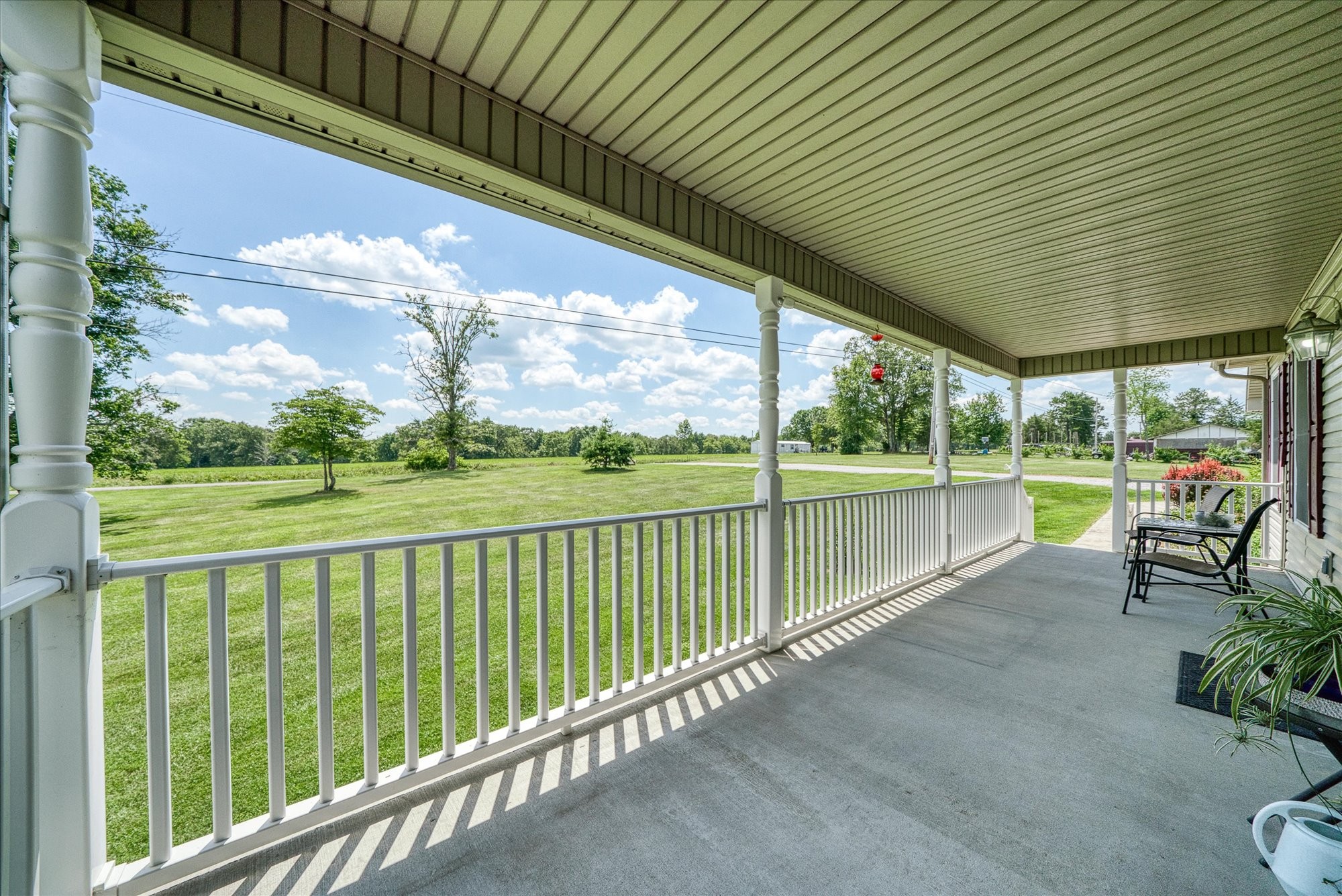 125 Clarence Lee Road Lancing, TN 37770 - Photo 19 of 55 a view of a porch with furniture and garden