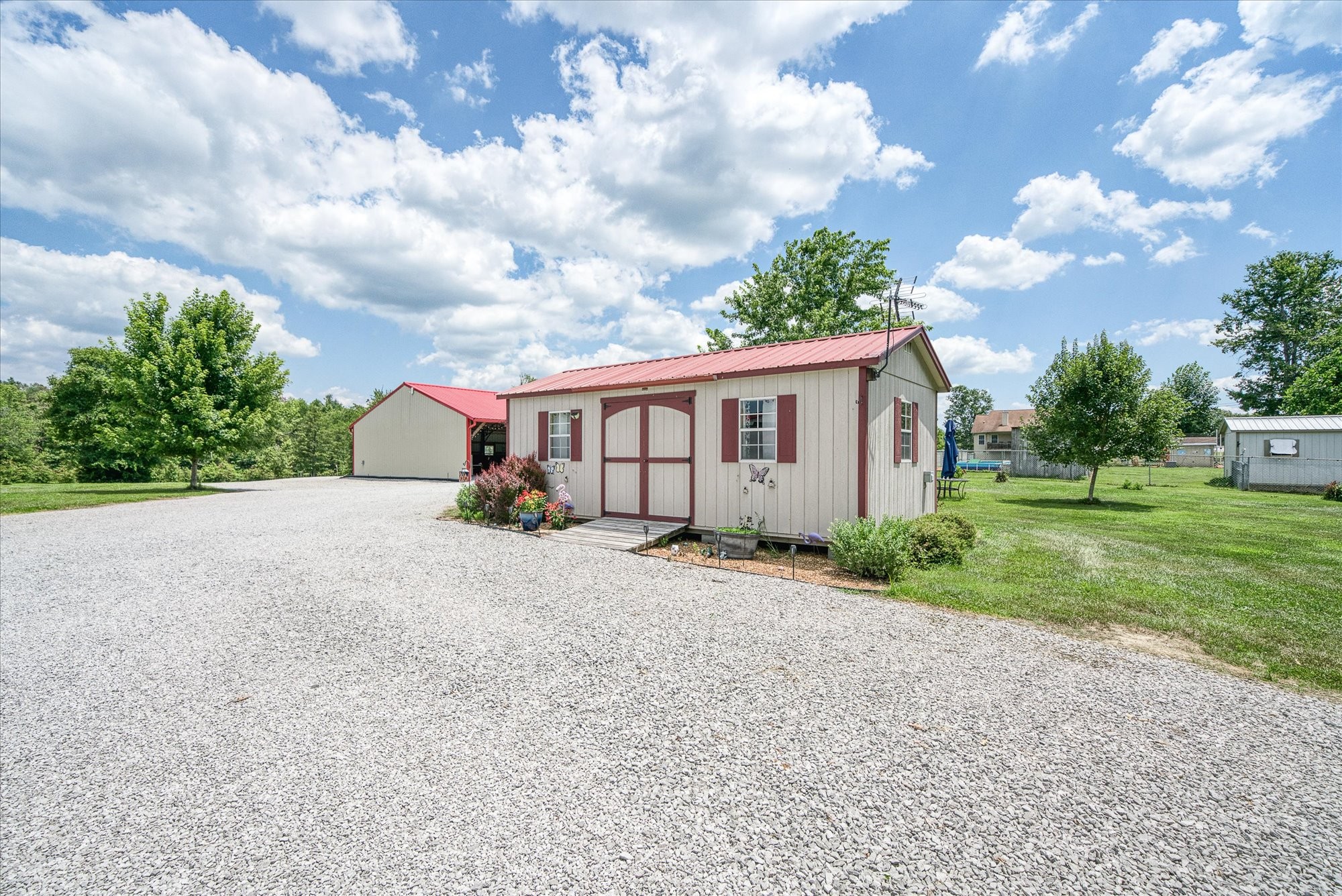 125 Clarence Lee Road Lancing, TN 37770 - Photo 29 of 55 a view of a house with a big yard and a large tree