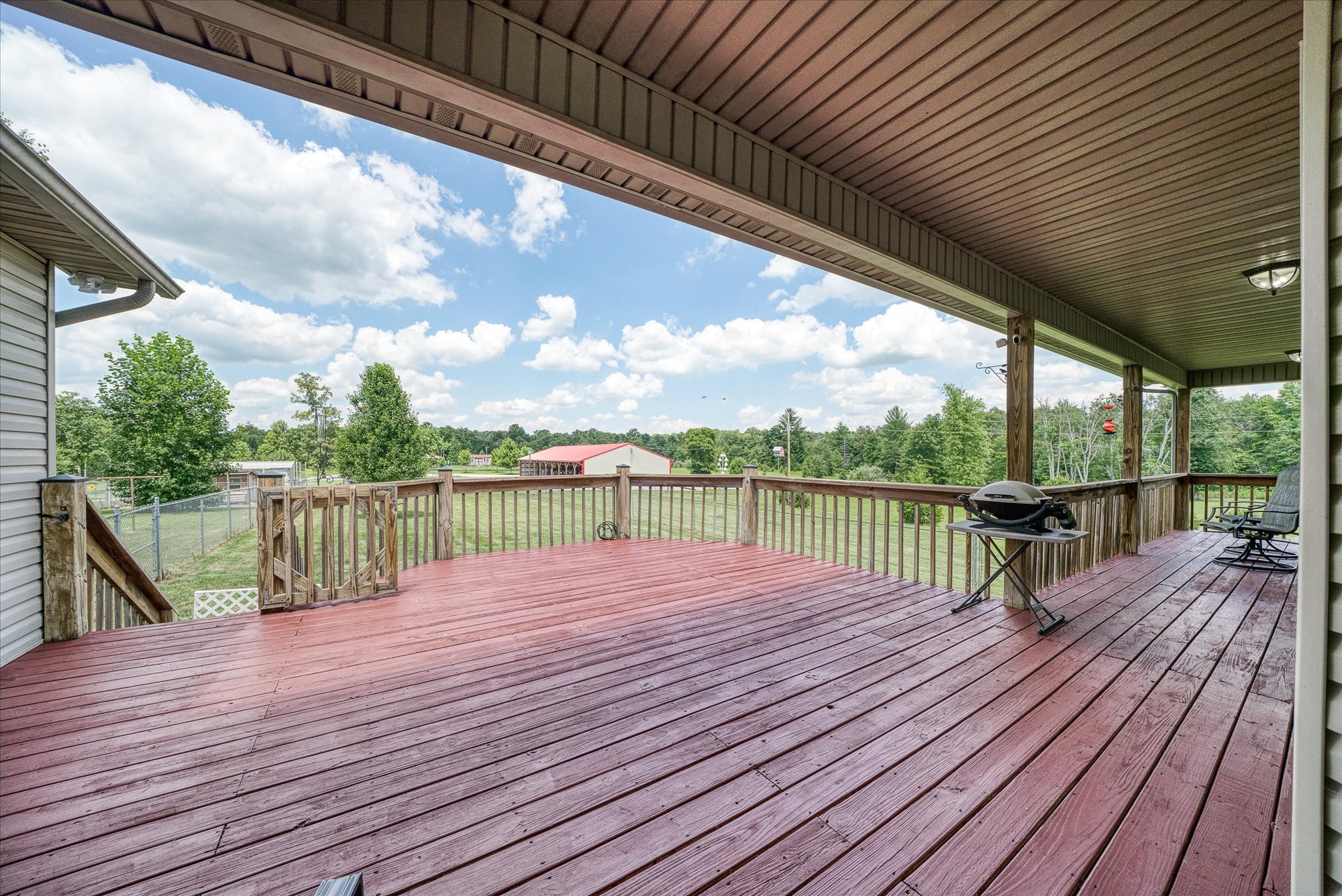 125 Clarence Lee Road Lancing, TN 37770 - Photo 3 of 55 a view of deck with wooden floor and seating space