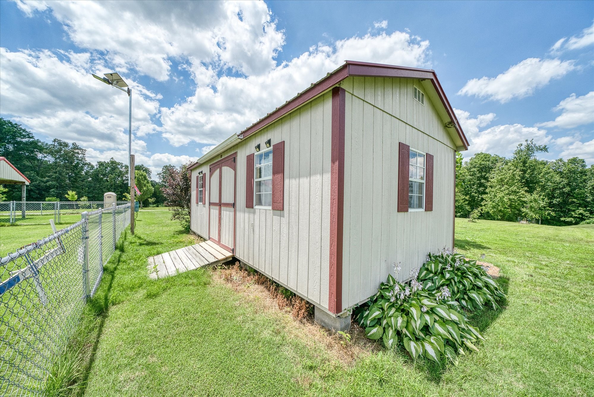 125 Clarence Lee Road Lancing, TN 37770 - Photo 37 of 55 a view of an house with backyard and trees