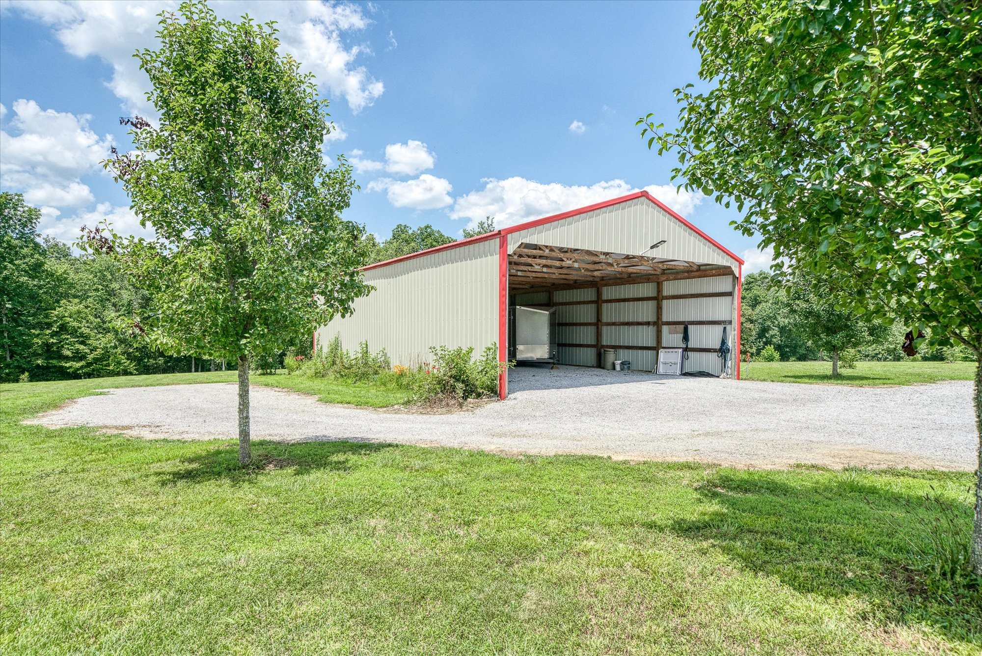 125 Clarence Lee Road Lancing, TN 37770 - Photo 39 of 55 a front view of a house with a garage