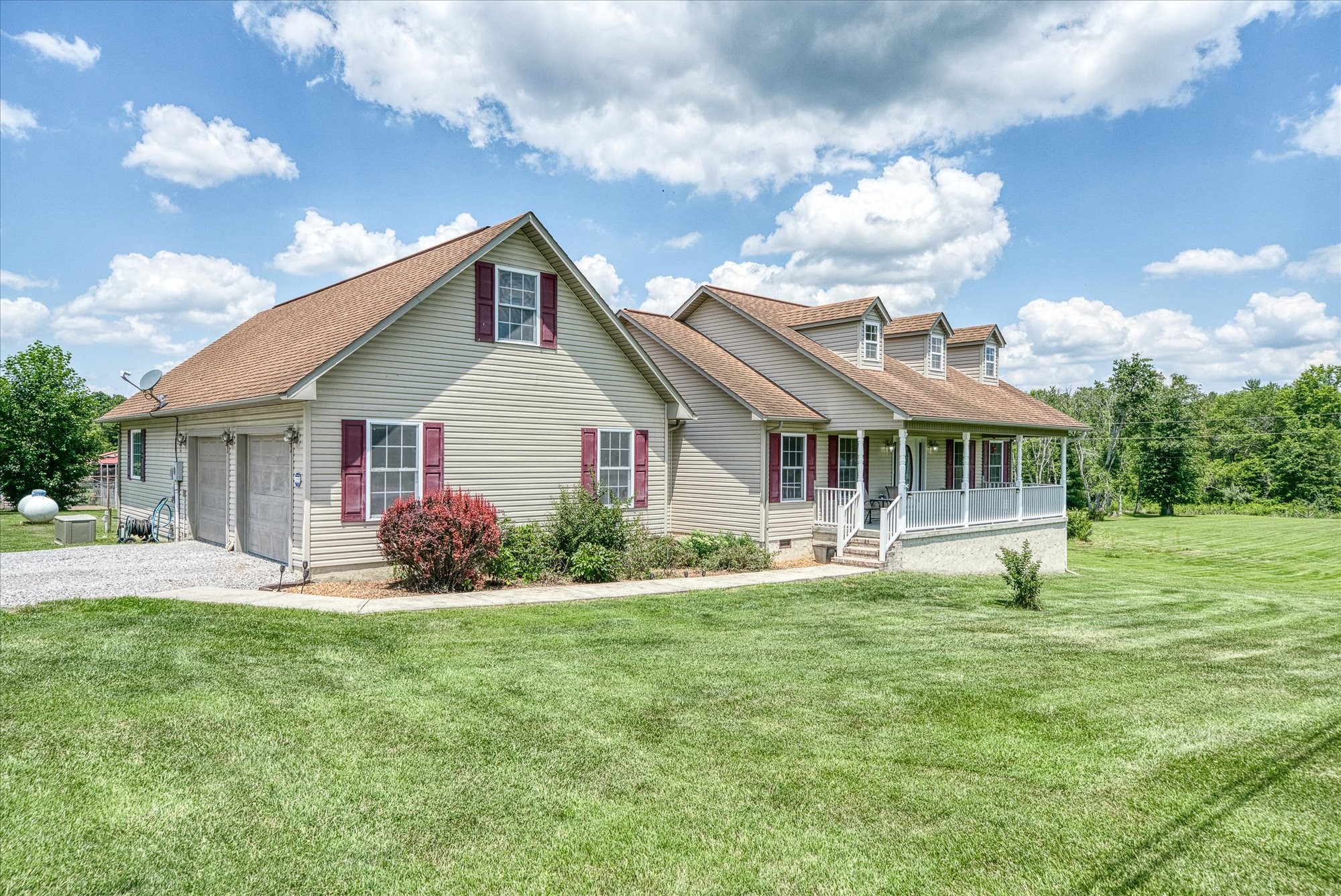 125 Clarence Lee Road Lancing, TN 37770 - Photo 42 of 55 a front view of house with yard and green space