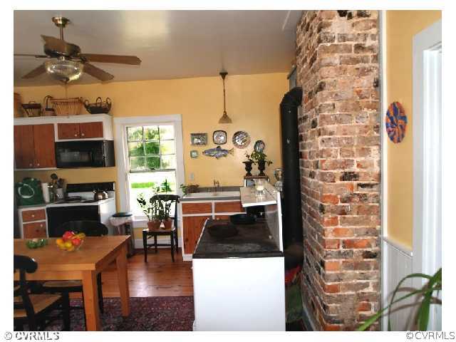 4974 Tabscott Road Kents Store, VA 23084 - Photo 3 of 11 a living room with fireplace furniture and a flat screen tv