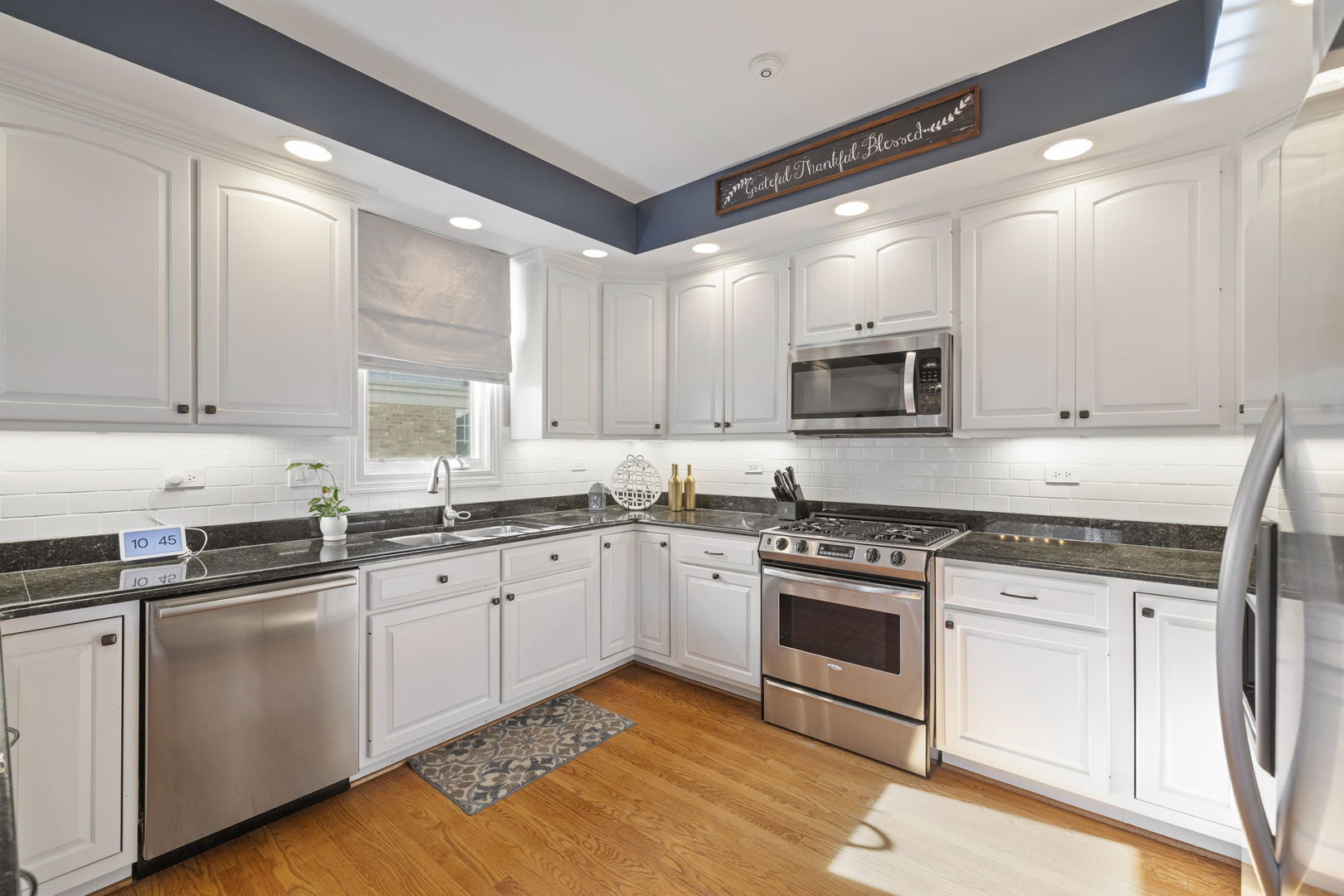 611 Fairfield Avenue Elmhurst, IL 60126 - Photo 12 of 44 a kitchen with granite countertop white cabinets and appliances