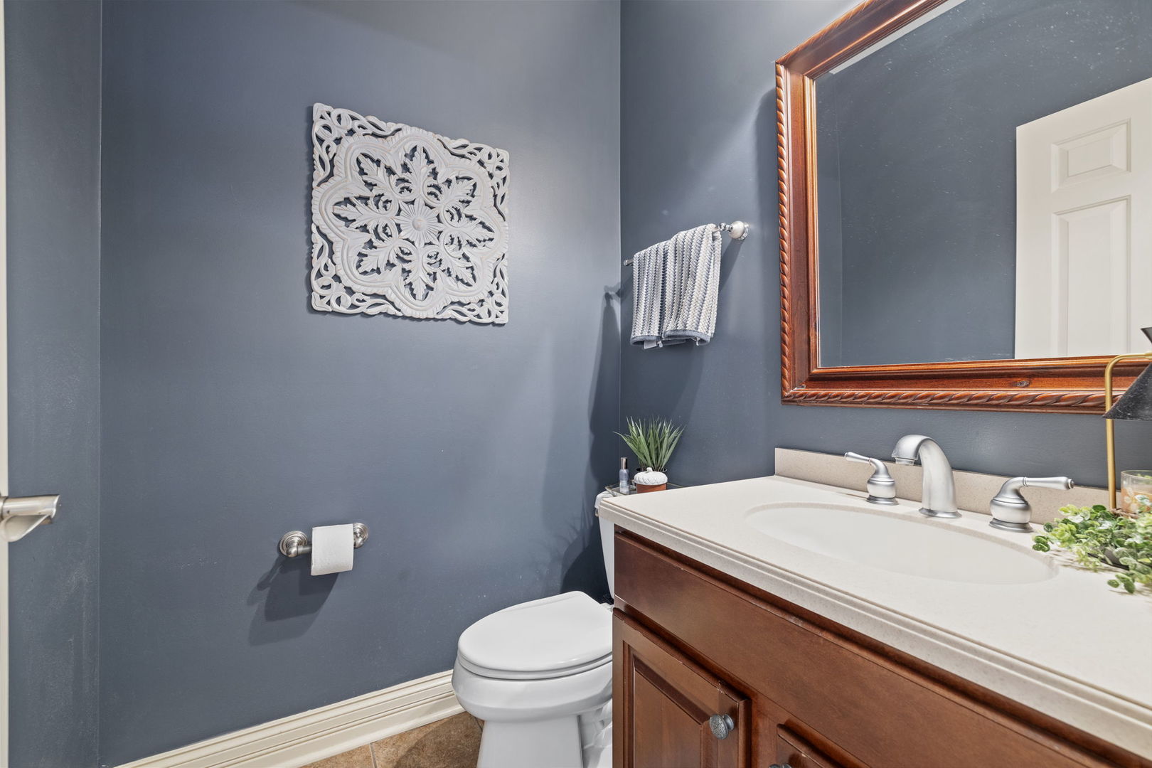 611 Fairfield Avenue Elmhurst, IL 60126 - Photo 17 of 44 a bathroom with a sink mirror and toilet