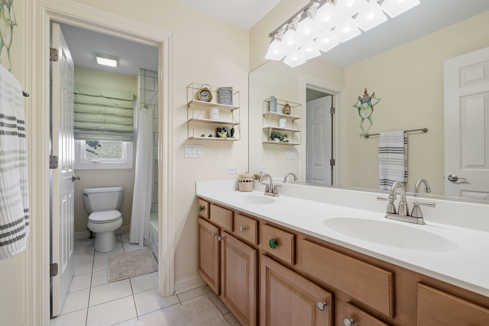 611 Fairfield Avenue Elmhurst, IL 60126 - Photo 21 of 44 a bathroom with a sink a toilet and a mirror