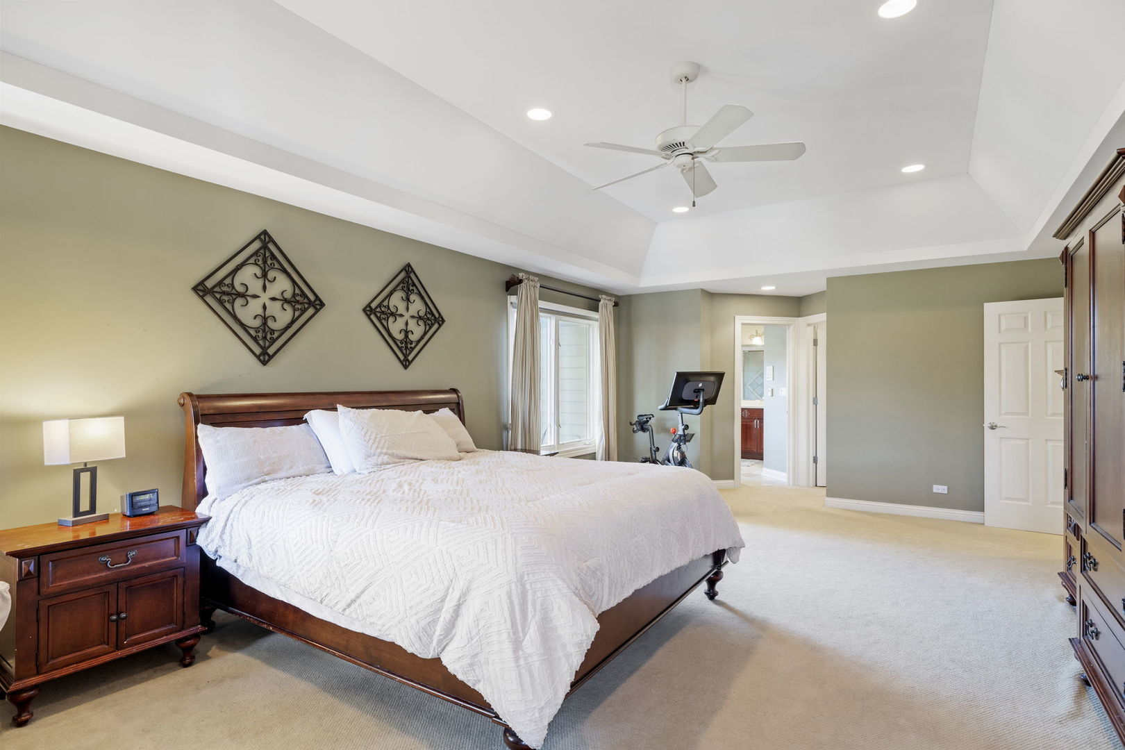 611 Fairfield Avenue Elmhurst, IL 60126 - Photo 23 of 44 a bedroom with a large bed and a chandelier