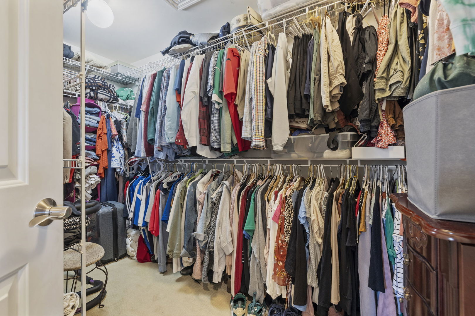 611 Fairfield Avenue Elmhurst, IL 60126 - Photo 26 of 44 a view of walk in closet with clothes