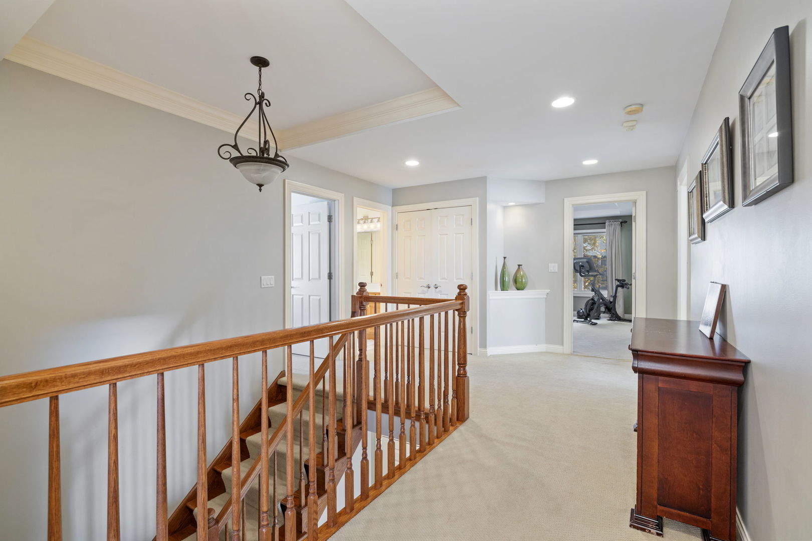 611 Fairfield Avenue Elmhurst, IL 60126 - Photo 30 of 44 a view of a hallway with a livingroom and chandelier