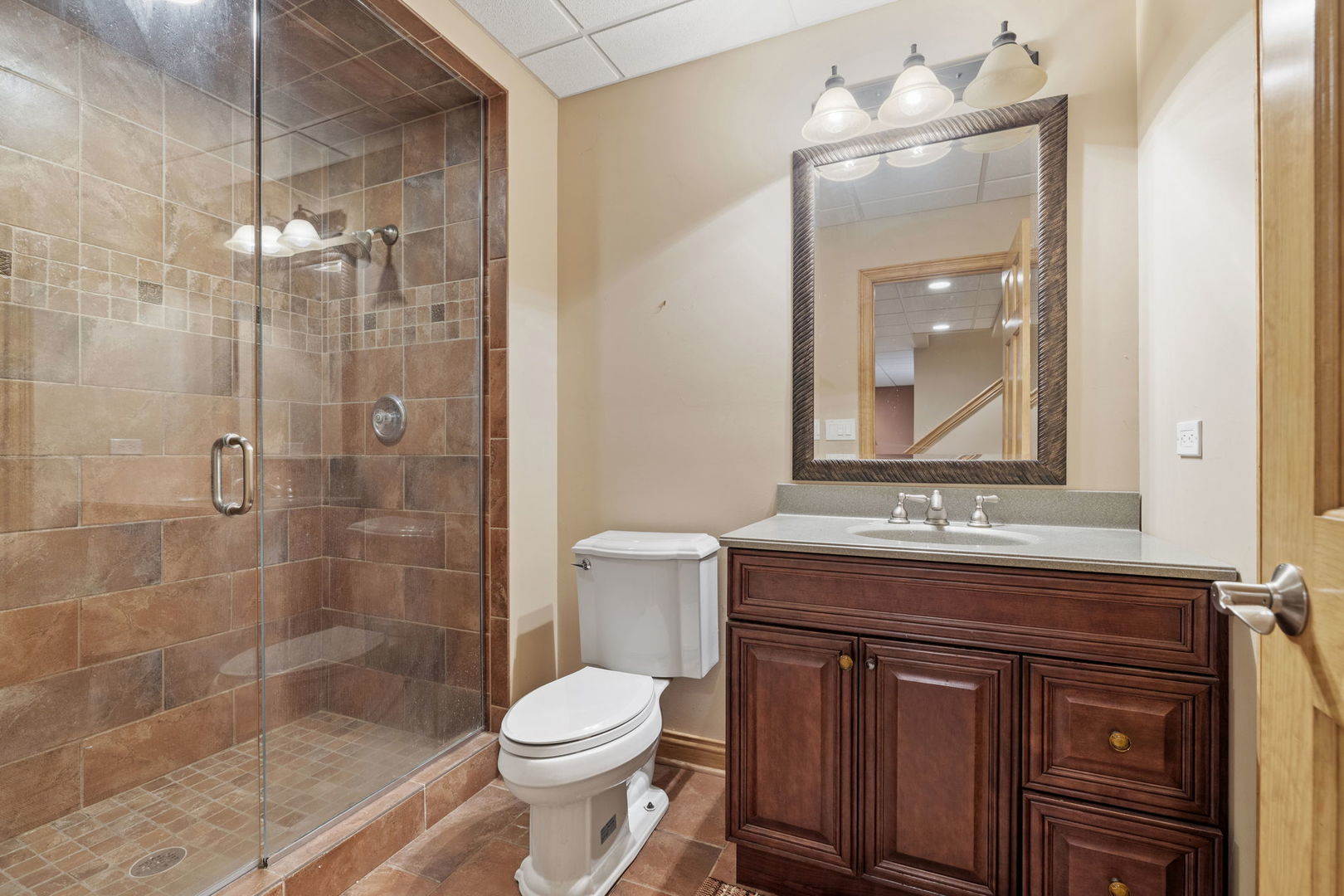 611 Fairfield Avenue Elmhurst, IL 60126 - Photo 33 of 44 a bathroom with a sink a toilet and shower