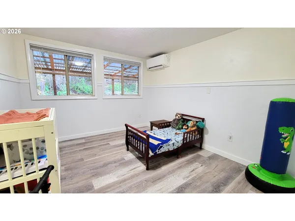 a bathroom with a toilet a sink and a mirror