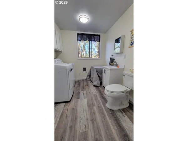 a room with gym equipment and a window