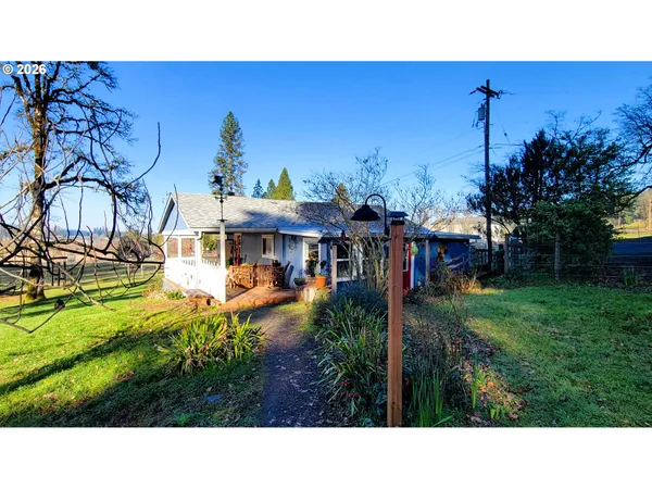 a view of a living room and a balcony