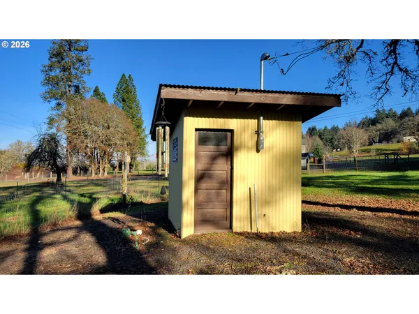 a bathroom with a small yard and trees