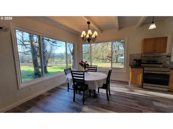 a open kitchen with stainless steel appliances granite countertop a stove a sink dishwasher and a refrigerator