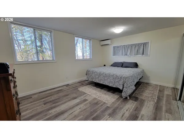 a room with a bed furniture and a window