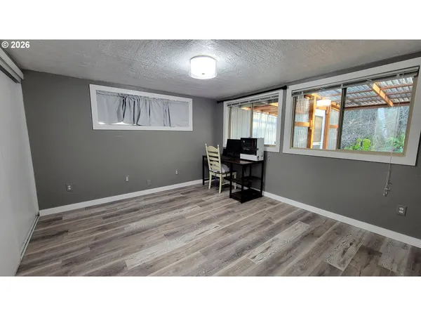 a hallway with a large mirror and cabinets