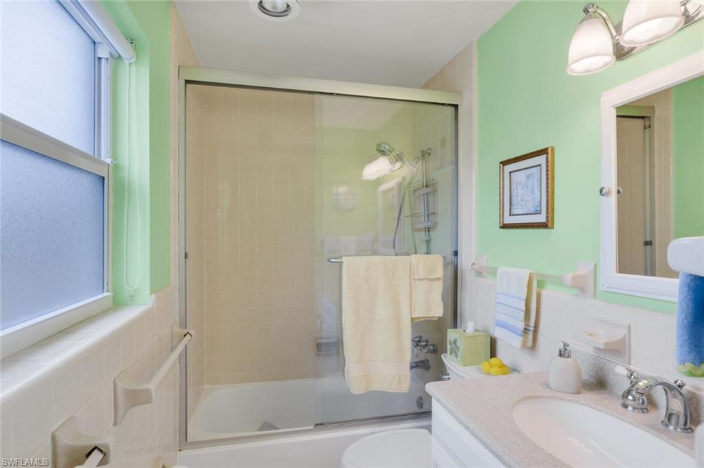 780 10th Avenue South, Unit 22 Naples, FL 34102 - Photo 17 of 17 a bathroom with a sink and a mirror