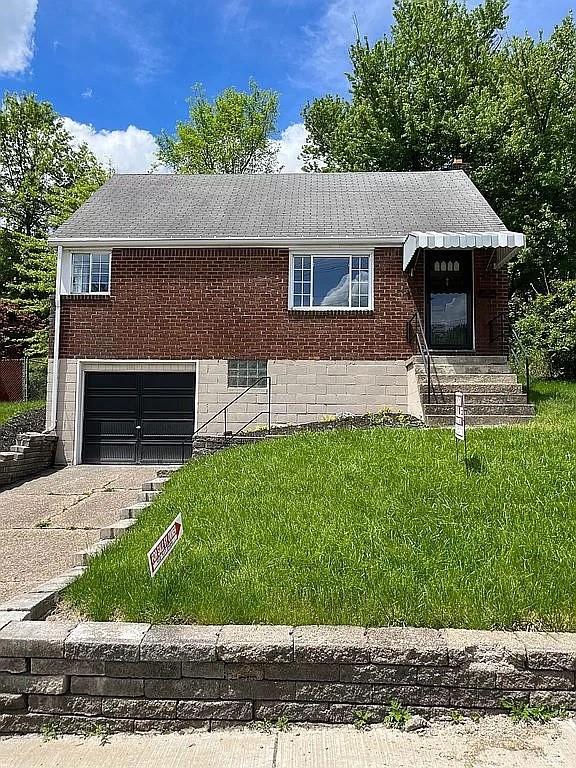 330 Beulah Road Pittsburgh, PA 15235 - Photo 1 of 24 a front view of a house with a garden and yard