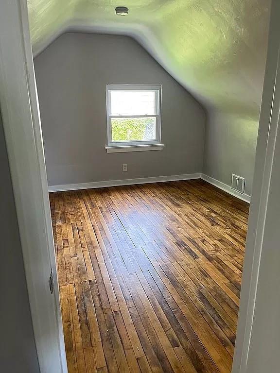 330 Beulah Road Pittsburgh, PA 15235 - Photo 14 of 24 a view of an empty room with wooden floor and a window