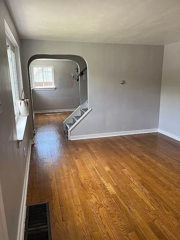 330 Beulah Road Pittsburgh, PA 15235 - Photo 4 of 24 an empty room with wooden floor and windows