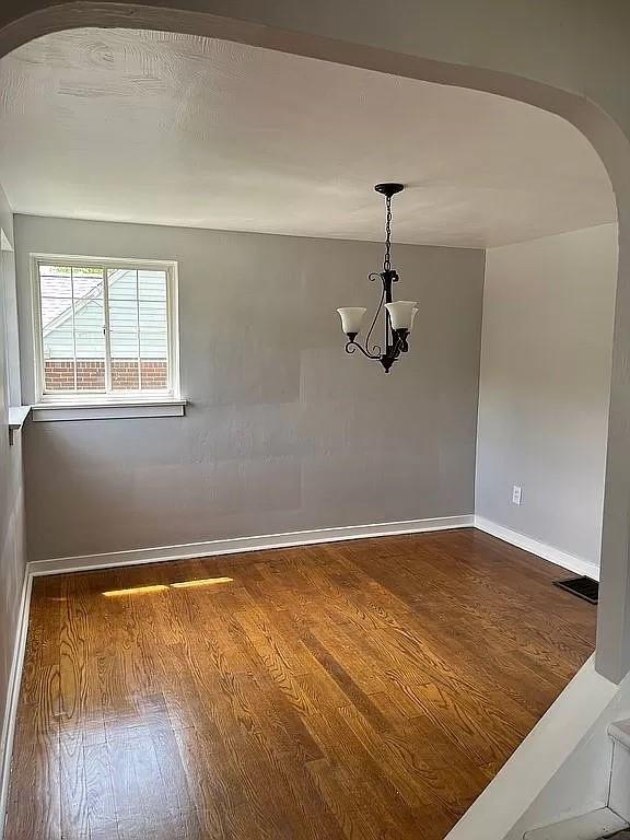 330 Beulah Road Pittsburgh, PA 15235 - Photo 5 of 24 an empty room with wooden floor ceiling fan and windows