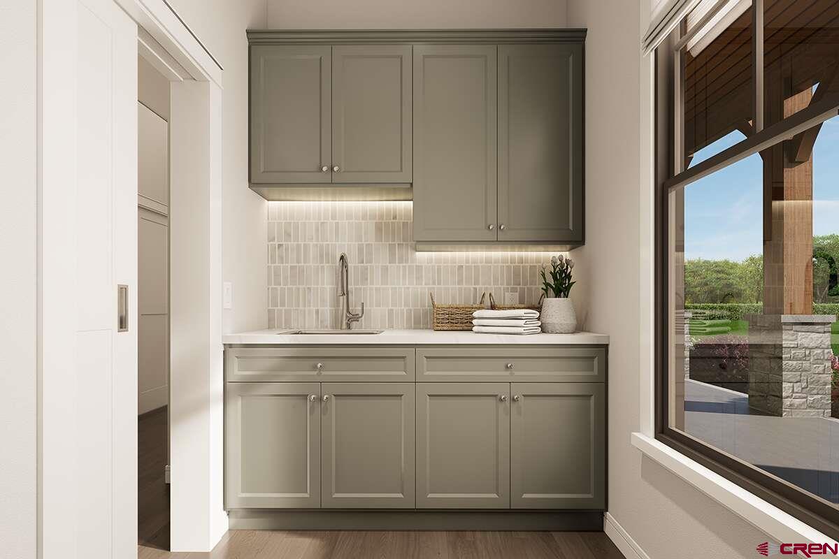 18371 2325 Road Cedaredge, CO 81413 - Photo 9 of 14 a kitchen with stainless steel appliances granite countertop a sink and a refrigerator