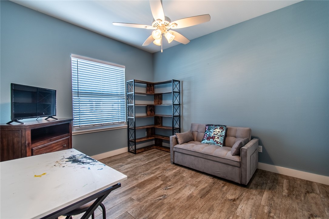 15422 Dyna Street Corpus Christi, TX 78418 - Photo 11 of 40 a living room with furniture and a flat screen tv