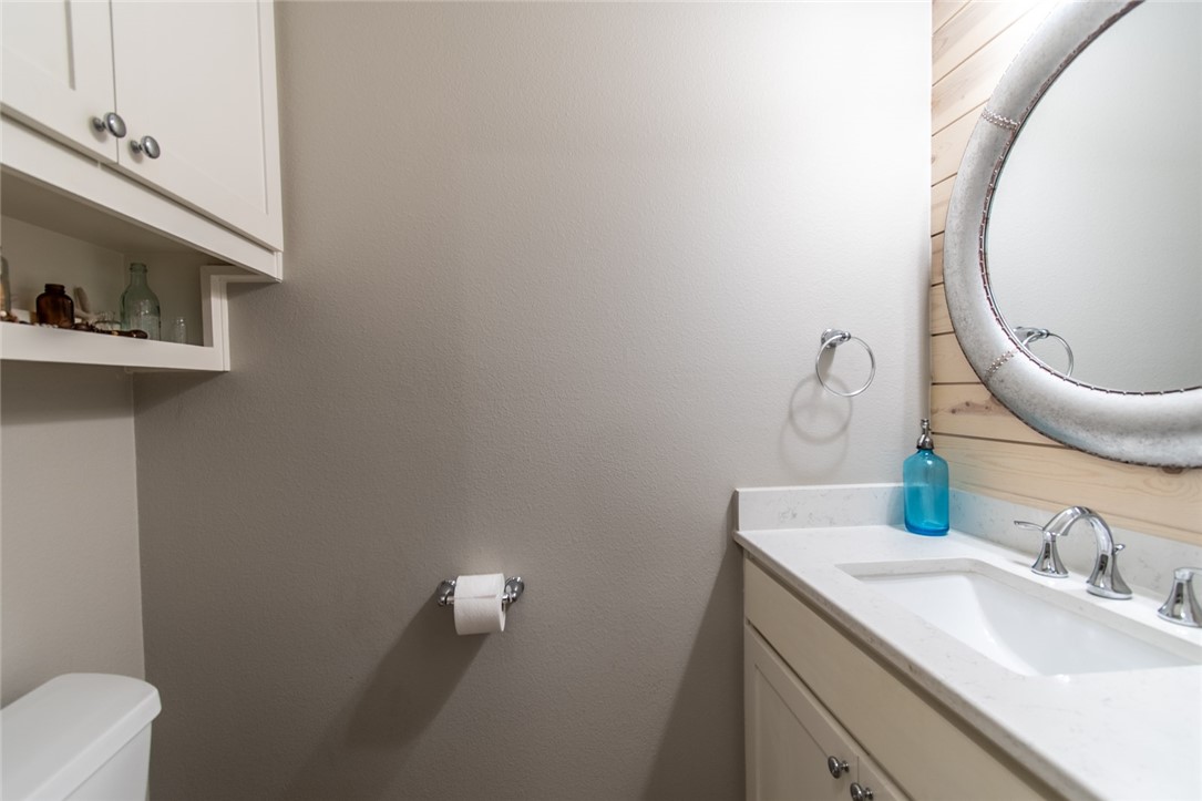 15422 Dyna Street Corpus Christi, TX 78418 - Photo 17 of 40 a bathroom with a sink and a mirror