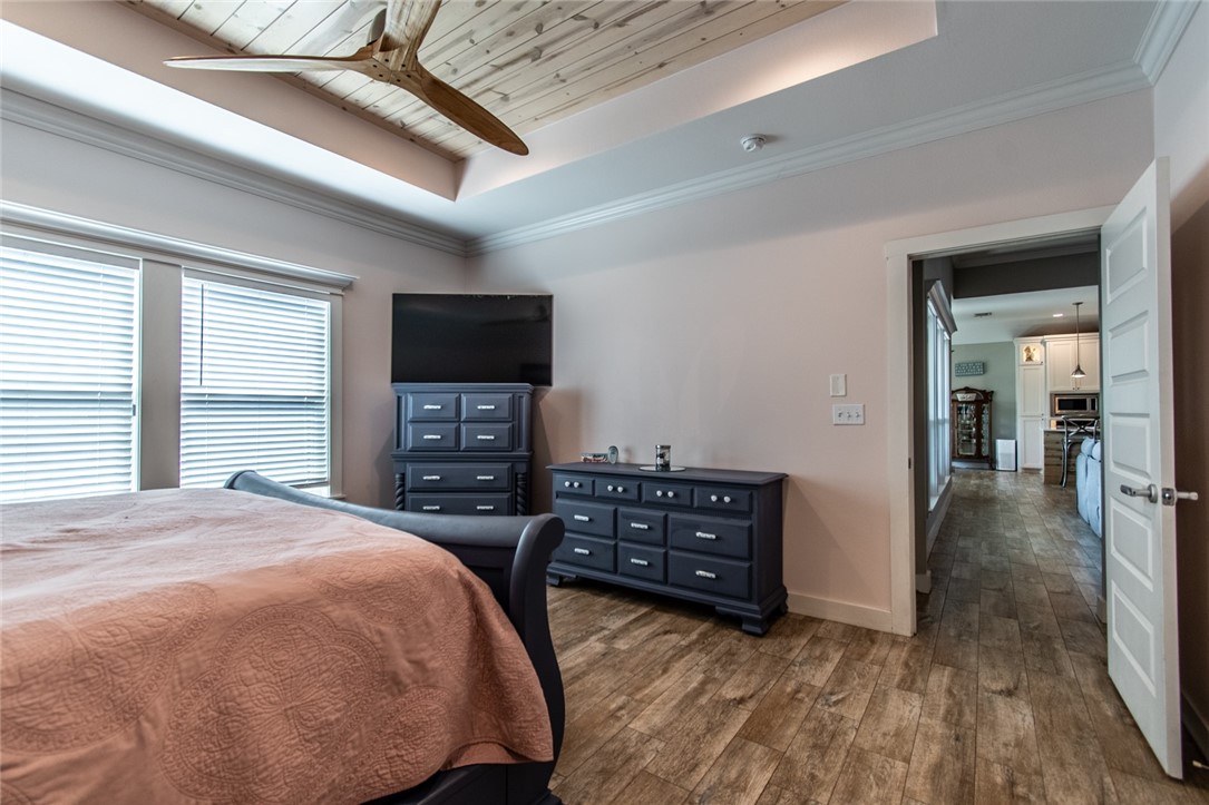 15422 Dyna Street Corpus Christi, TX 78418 - Photo 24 of 40 a bedroom with furniture and a flat tv screen