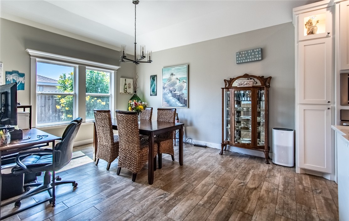 15422 Dyna Street Corpus Christi, TX 78418 - Photo 25 of 40 a view of a dining room with furniture window and wooden floor