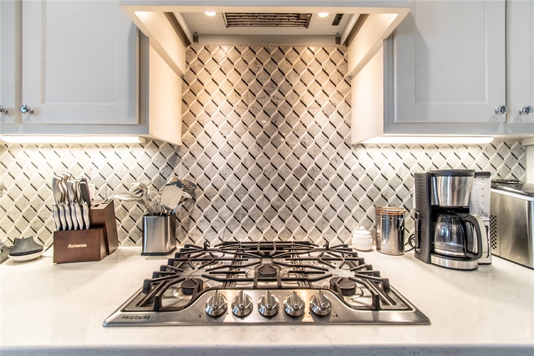 15422 Dyna Street Corpus Christi, TX 78418 - Photo 30 of 40 a view of a sink and dishwasher with wooden floor