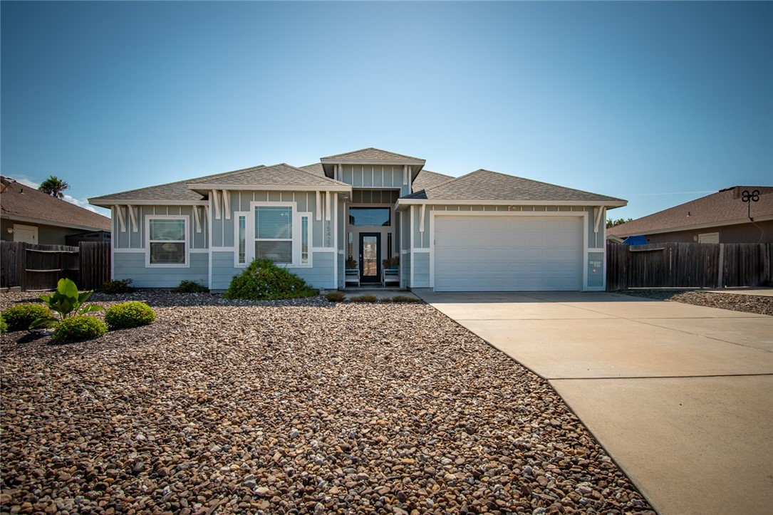 15422 Dyna Street Corpus Christi, TX 78418 - Photo 3 of 40 a front view of a house with garden