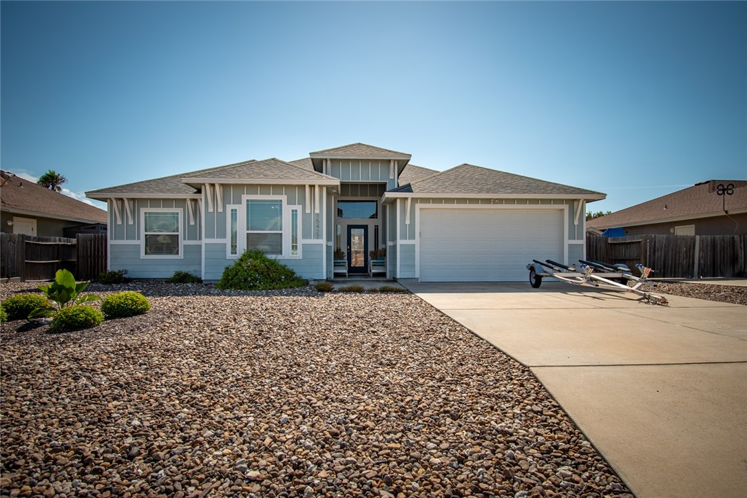 15422 Dyna Street Corpus Christi, TX 78418 - Photo 4 of 40 a front view of a house with a garden