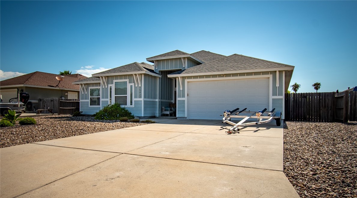 15422 Dyna Street Corpus Christi, TX 78418 - Photo 6 of 40 a backyard of a house with table and chairs