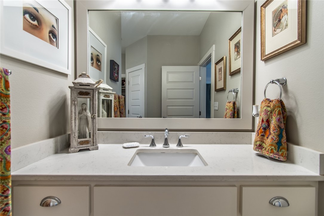 15422 Dyna Street Corpus Christi, TX 78418 - Photo 9 of 40 a bathroom with a sink and a mirror