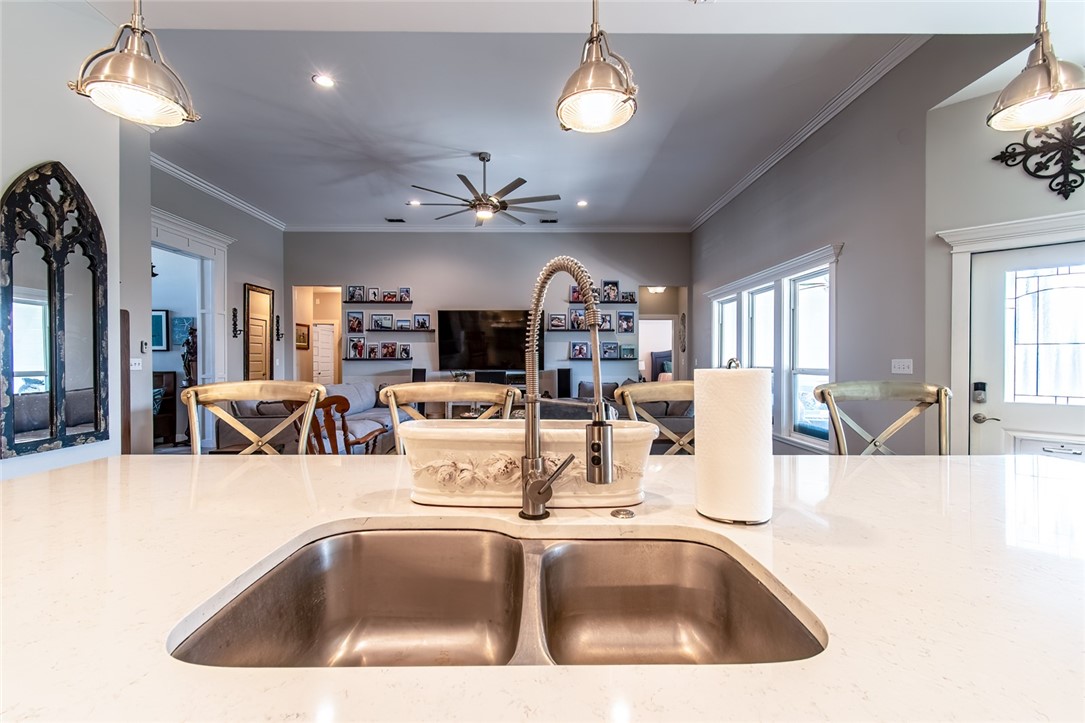 15422 Dyna Street Corpus Christi, TX 78418 - Photo 10 of 40 a view of kitchen center island sink stove and living room