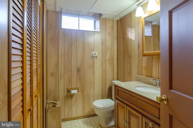 a view of a livingroom with wooden floor and a window